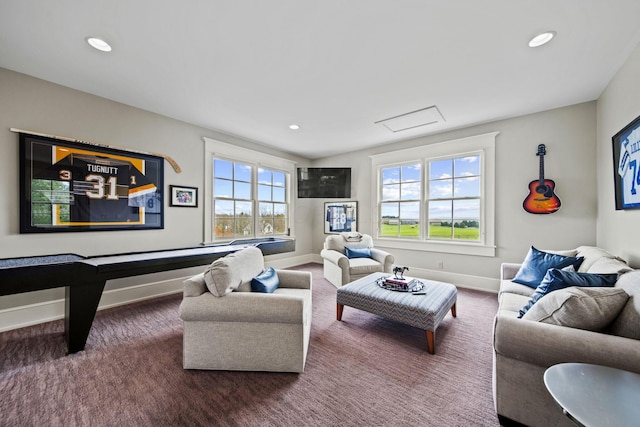 living area with baseboards, carpet, and recessed lighting
