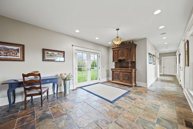 interior space featuring french doors, baseboards, stone tile flooring, and recessed lighting