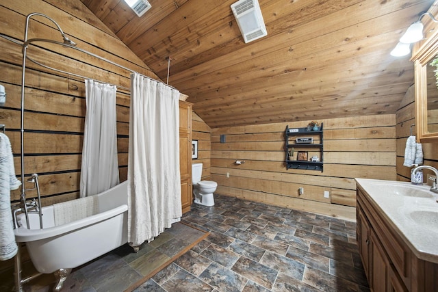 full bath with vaulted ceiling, toilet, wood walls, wood ceiling, and a sink