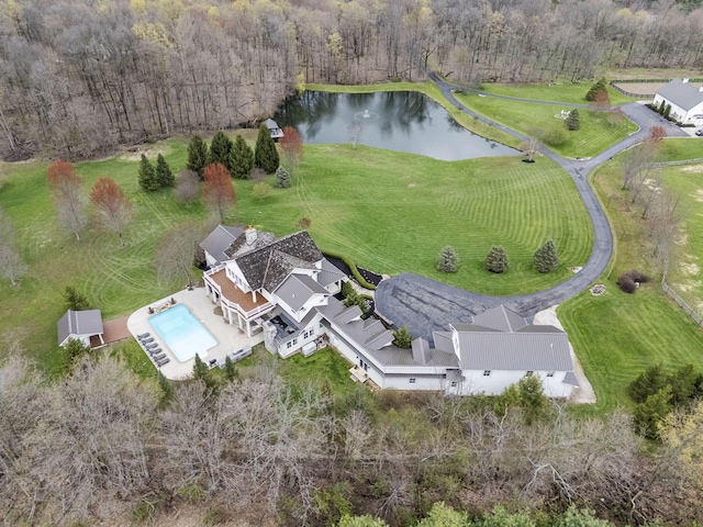 birds eye view of property with a water view