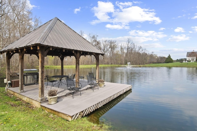 dock area with a water view and a gazebo