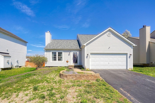 2655 Cross Creek Ave, Lancaster, OH 43130 - traditional home with a chimney, aphalt driveway, a garage, roof with shingles, and a front lawn