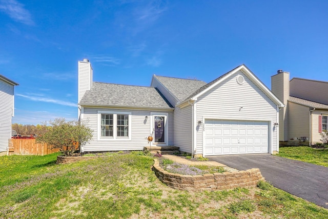 2655 Cross Creek Ave, Lancaster, OH 43130 - view of front of property with a chimney, fence, a garage, driveway, and a front lawn