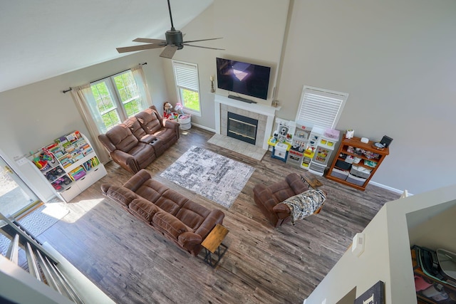 2655 Cross Creek Ave, Lancaster, OH 43130 - living area featuring ceiling fan, baseboards, a fireplace, wood finished floors, and high vaulted ceiling