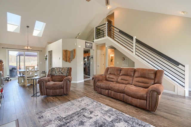 2655 Cross Creek Ave, Lancaster, OH 43130 - living room featuring a skylight, wood finished floors, stairway, baseboards, and high vaulted ceiling