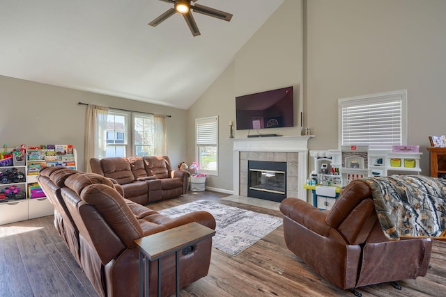 2655 Cross Creek Ave, Lancaster, OH 43130 - living room featuring a tiled fireplace, high vaulted ceiling, wood finished floors, and ceiling fan