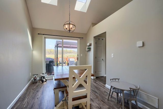 2655 Cross Creek Ave, Lancaster, OH 43130 - dining room with baseboards, a skylight, a chandelier, and dark wood-style flooring