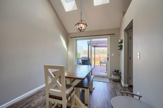 2655 Cross Creek Ave, Lancaster, OH 43130 - dining space featuring a skylight, wood finished floors, baseboards, high vaulted ceiling, and a notable chandelier