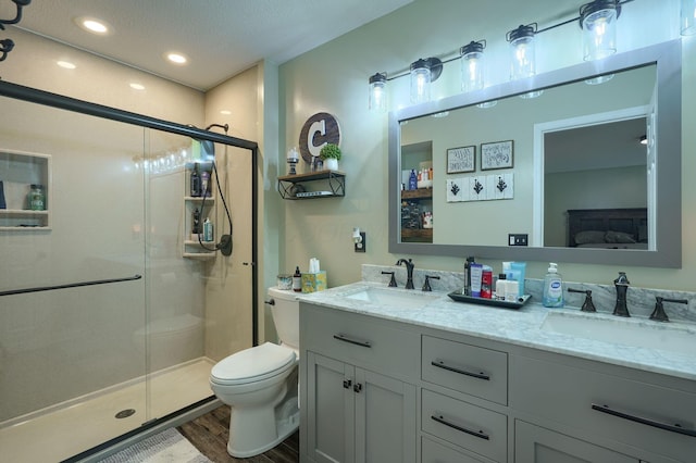 2655 Cross Creek Ave, Lancaster, OH 43130 - ensuite bathroom with wood finished floors, a shower stall, toilet, and a sink