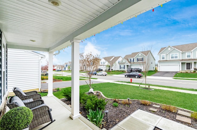 view of patio with a residential view and covered porch