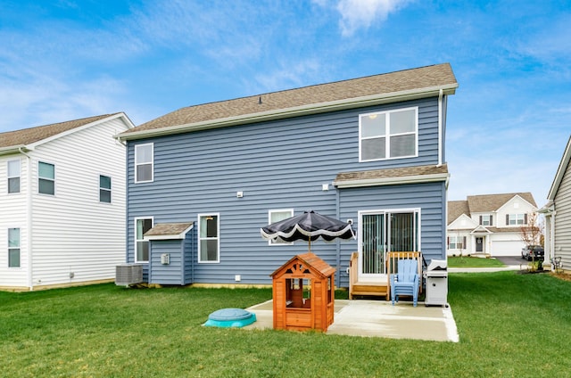 back of property with cooling unit, a yard, and a patio