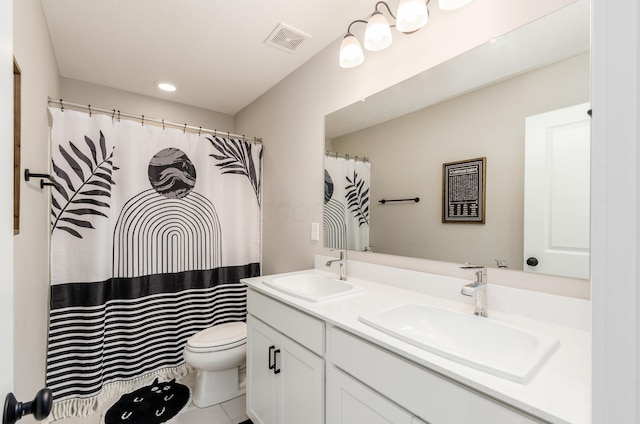 bathroom with toilet, a sink, visible vents, and double vanity