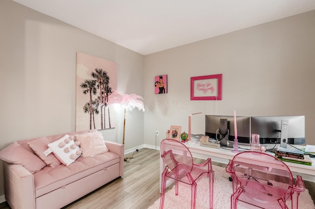 home office with baseboards and light wood-style floors