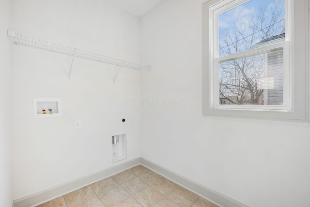 clothes washing area featuring baseboards, washer hookup, laundry area, electric dryer hookup, and light tile patterned flooring