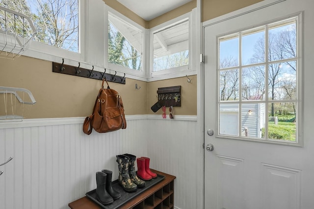 mudroom with a healthy amount of sunlight and a wainscoted wall