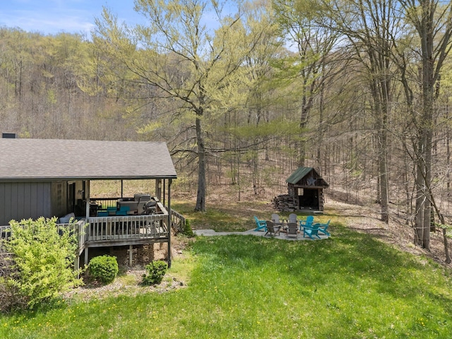 19990 Sowers Rd, Laurelville, OH 43135 - view of yard with a patio, a wooden deck, a forest view, and an outdoor living space with a fireplace