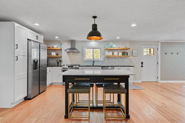 19990 Sowers Rd, Laurelville, OH 43135 - kitchen with stainless steel appliances, open shelves, light wood-type flooring, wall chimney exhaust hood, and backsplash