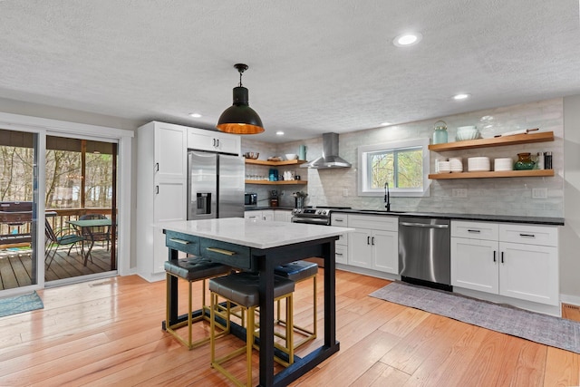 19990 Sowers Rd, Laurelville, OH 43135 - kitchen with stainless steel appliances, open shelves, a textured ceiling, a sink, and wall chimney exhaust hood