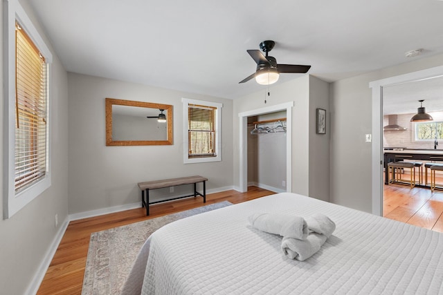 19990 Sowers Rd, Laurelville, OH 43135 - bedroom with ceiling fan, a closet, light wood finished floors, and baseboards