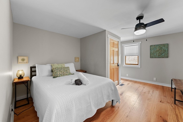19990 Sowers Rd, Laurelville, OH 43135 - bedroom featuring a ceiling fan, visible vents, wood finished floors, and baseboards