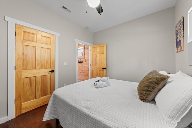 19990 Sowers Rd, Laurelville, OH 43135 - bedroom featuring visible vents, a ceiling fan, and concrete flooring