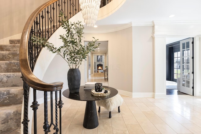 2 Albery Loop, New Albany, OH 43054 - staircase featuring tile patterned floors, a notable chandelier, baseboards, and crown molding