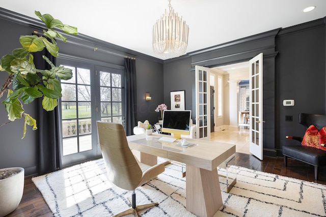 2 Albery Loop, New Albany, OH 43054 - office area with dark wood-type flooring, french doors, an inviting chandelier, and ornamental molding
