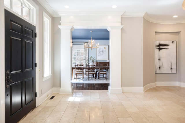 2 Albery Loop, New Albany, OH 43054 - entryway with ornamental molding, baseboards, decorative columns, and an inviting chandelier