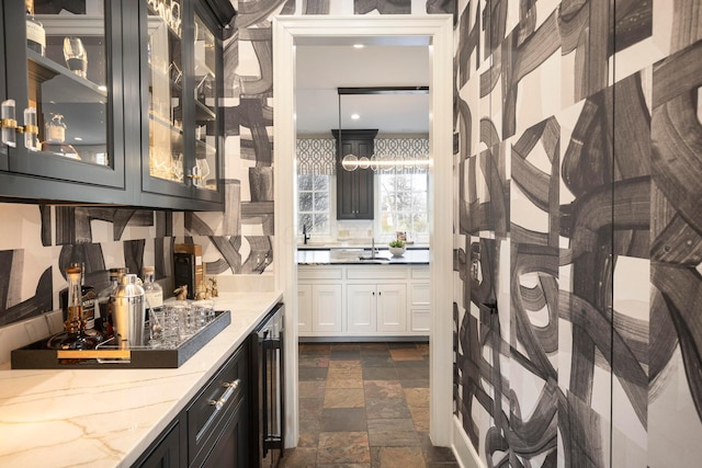 2 Albery Loop, New Albany, OH 43054 - bathroom featuring vanity, stone tile floors, and beverage cooler