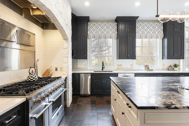 2 Albery Loop, New Albany, OH 43054 - kitchen with decorative backsplash, a sink, stone tile flooring, and stainless steel appliances