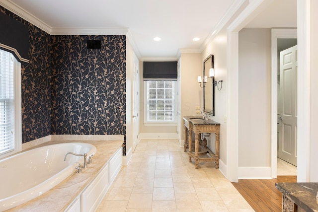 2 Albery Loop, New Albany, OH 43054 - bathroom featuring a bath, baseboards, a sink, and ornamental molding