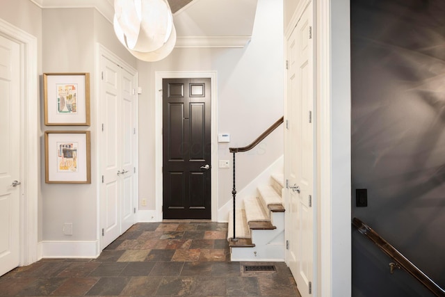 2 Albery Loop, New Albany, OH 43054 - entrance foyer featuring ornamental molding, visible vents, stone finish flooring, stairs, and baseboards