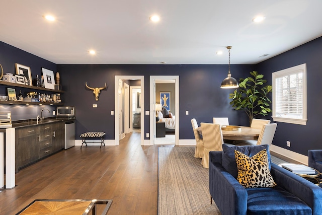 2 Albery Loop, New Albany, OH 43054 - dining room with wet bar, baseboards, dark wood-style floors, and recessed lighting