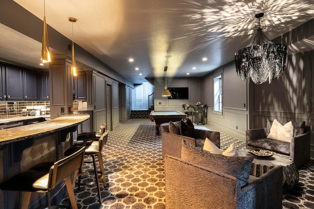 2 Albery Loop, New Albany, OH 43054 - playroom with an inviting chandelier, a decorative wall, billiards, recessed lighting, and a wainscoted wall