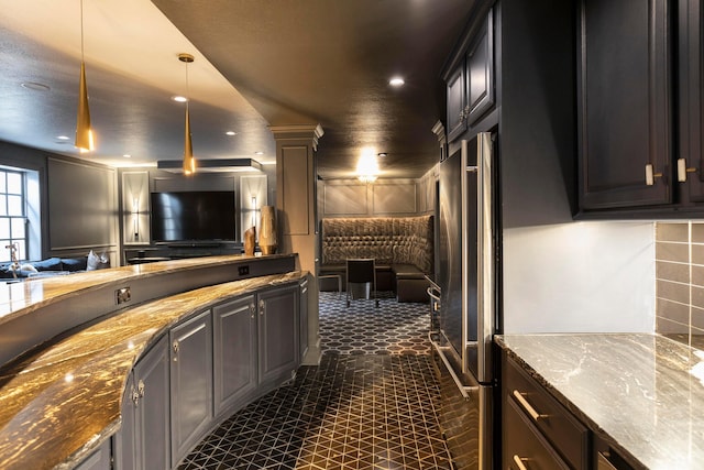 2 Albery Loop, New Albany, OH 43054 - kitchen with decorative light fixtures, recessed lighting, open floor plan, and stone counters