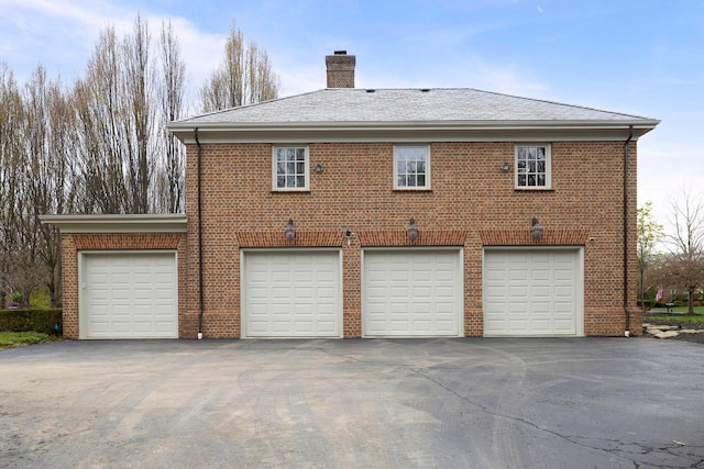 2 Albery Loop, New Albany, OH 43054 - exterior space with aphalt driveway, brick siding, and a chimney