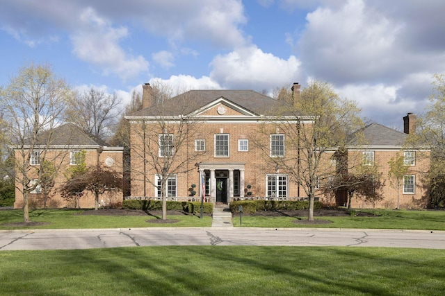 2 Albery Loop, New Albany, OH 43054 - colonial-style house with a front lawn, a chimney, and brick siding