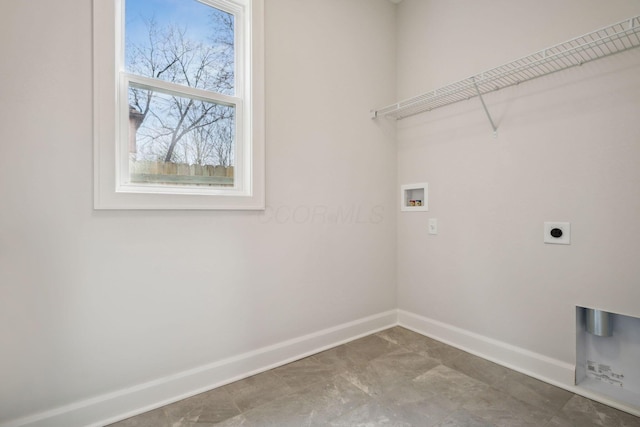 clothes washing area featuring baseboards, hookup for an electric dryer, hookup for a washing machine, and laundry area