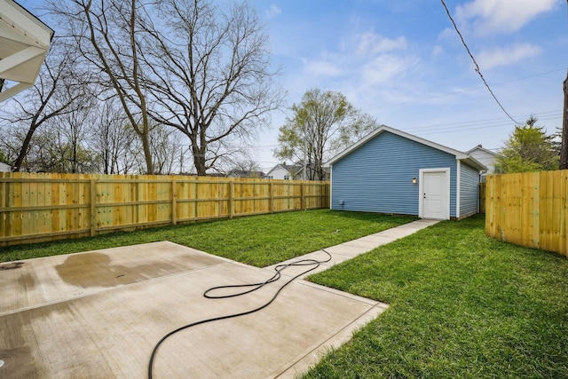view of yard featuring a fenced backyard, an outdoor structure, and a patio area