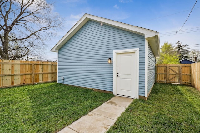 view of outbuilding featuring a gate and a fenced backyard