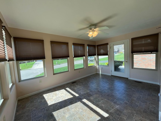 unfurnished sunroom with visible vents