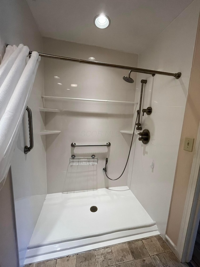 bathroom featuring a shower stall
