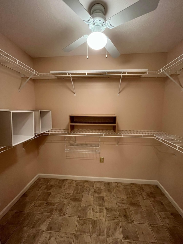 spacious closet featuring a ceiling fan