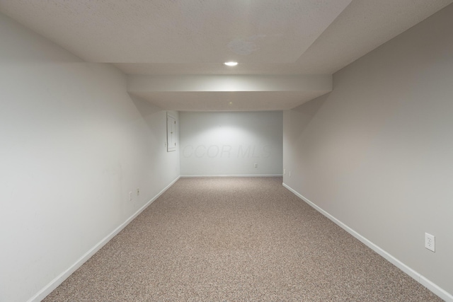 finished below grade area featuring carpet, baseboards, and recessed lighting