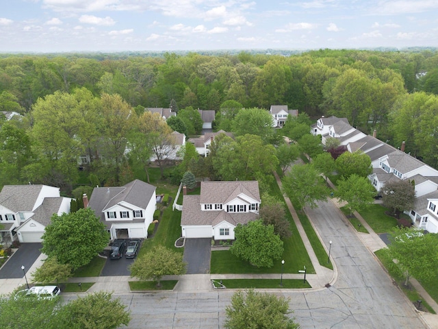 aerial perspective of suburban area with a forest