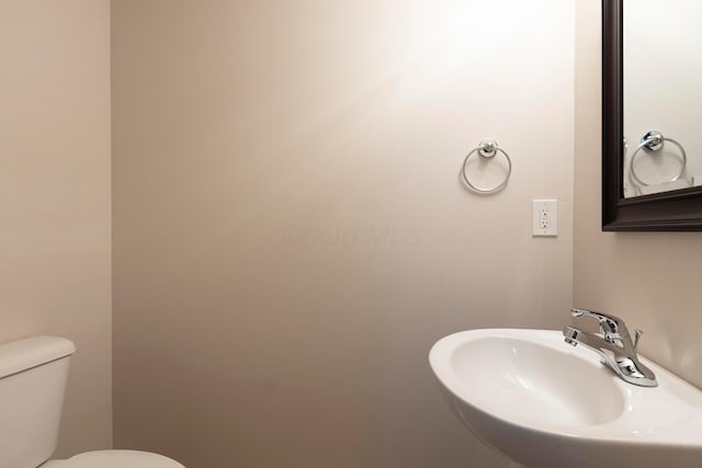 bathroom with a sink and toilet
