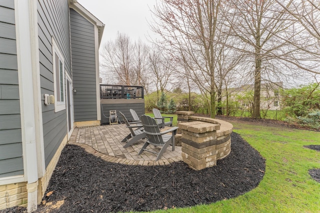 view of patio featuring a deck and fence