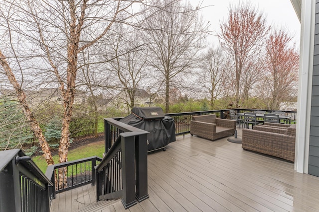 deck with grilling area and an outdoor living space