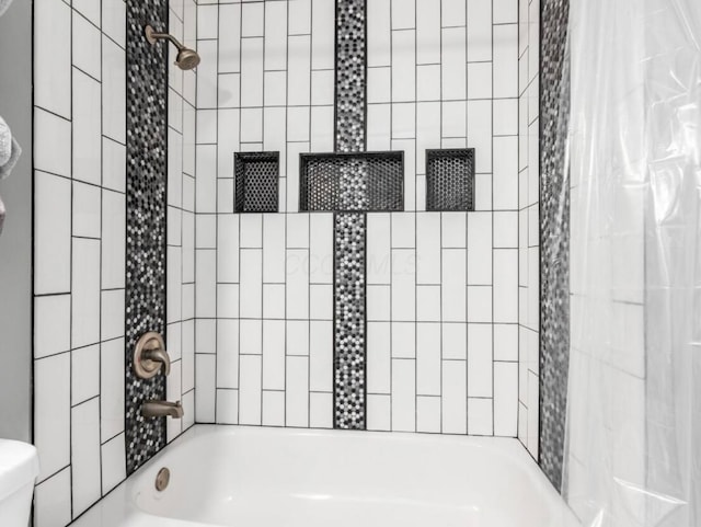 full bathroom featuring toilet and shower / tub combo