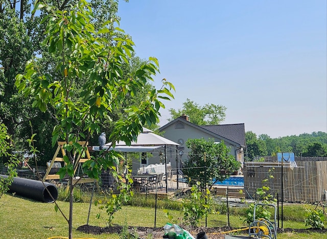 view of yard with a garden and fence